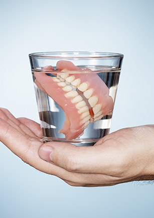 Dentures in glass of water
