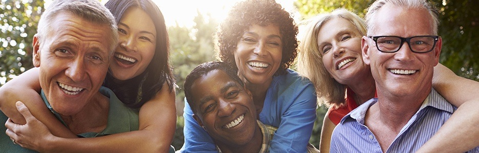 Three smilimg couples outdoors