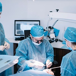 An oral surgeon performing a dental implant procedure