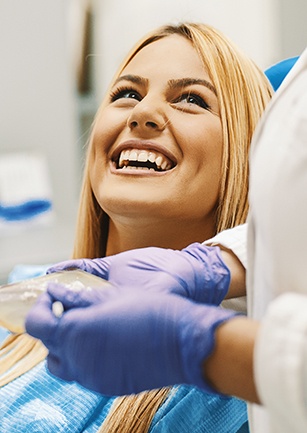 Laughing woman in dental chair