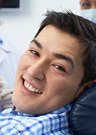 Smiling man in dental chair