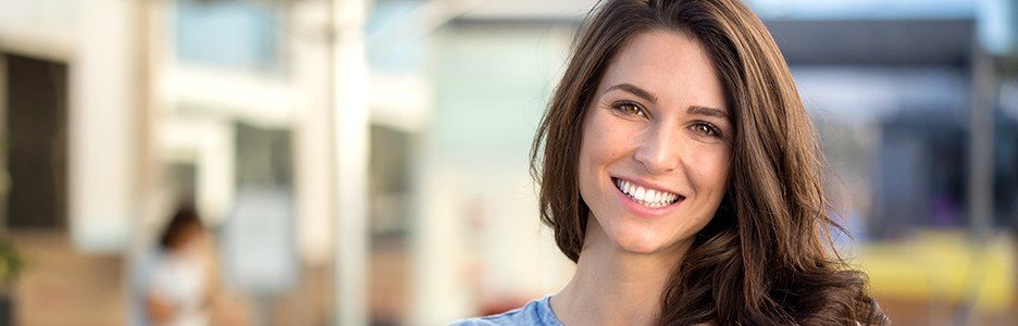 Woman smiling outdoors