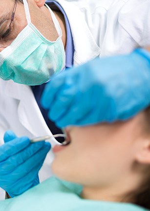 Dentist treating patient