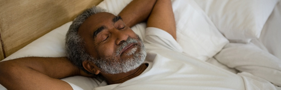 Man sleeping in a bed