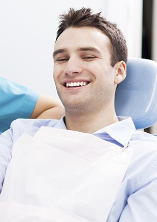 Smiling man in dental chair