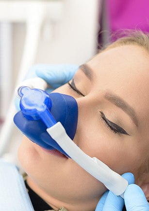 Woman with nitrous oxide nasal mask