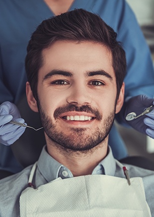 Smiling man in dental chair