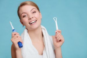 Woman with tongue scraper