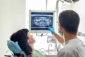 dentist showing patient their X-ray