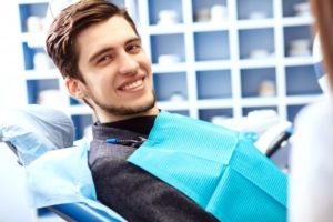 man experiencing benefits of tooth extraction