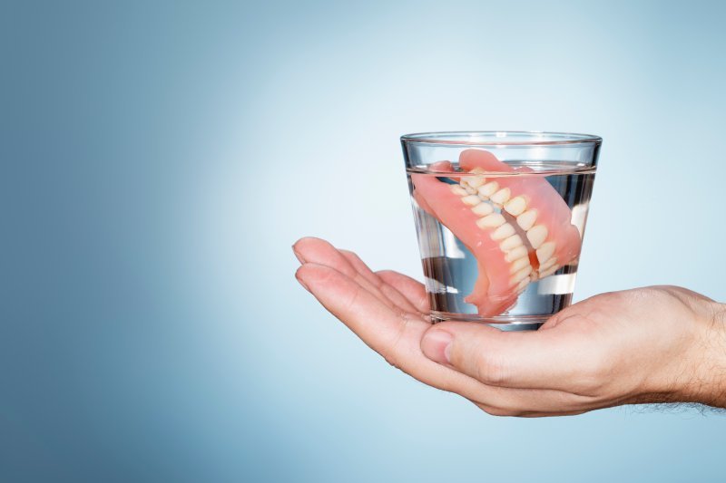 Full dentures in a glass of water