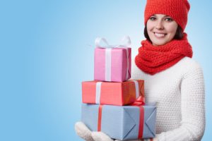 Smiling woman carrying gifts
