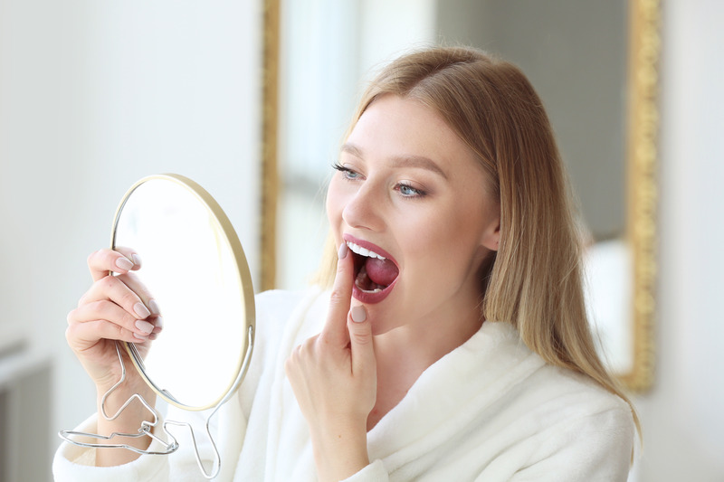 Patient checking veneers in mirror